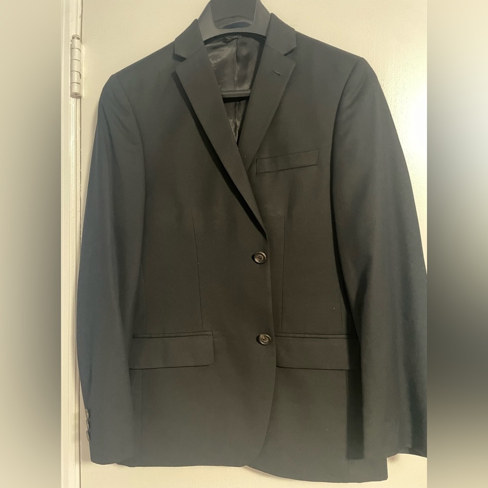 Boys size 16R 2 buttons black suit jacket. 2 front flap pockets,side back vents